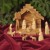KINDERKRIPPE 11-teilig. Krippenfiguren in Bethlehem handgeschnitzt aus Olivenholz. Höhe der stehenden Figuren circa 9 cm. - 3